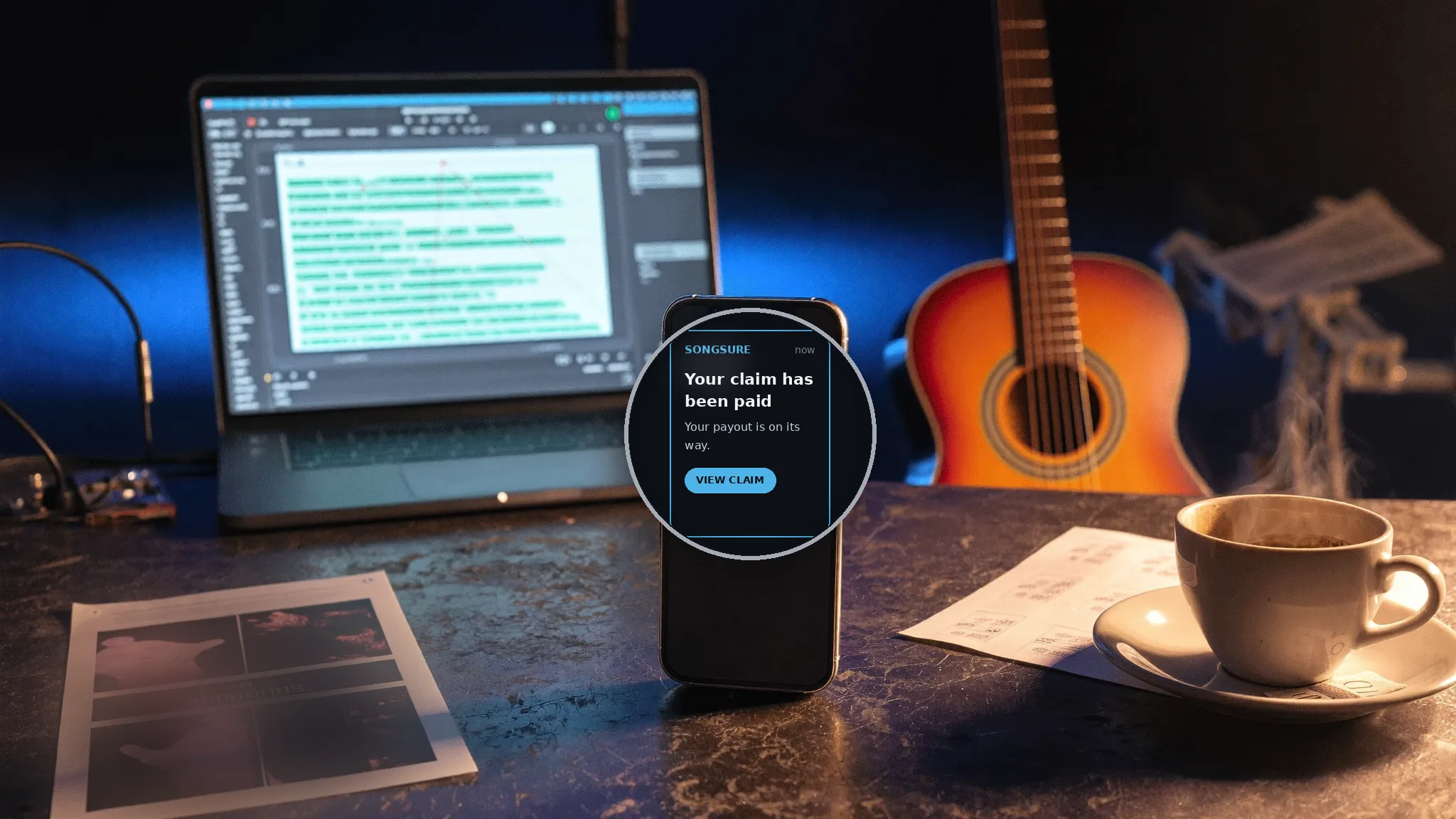 Phone showing a SongSure waitlist notification on a studio desk